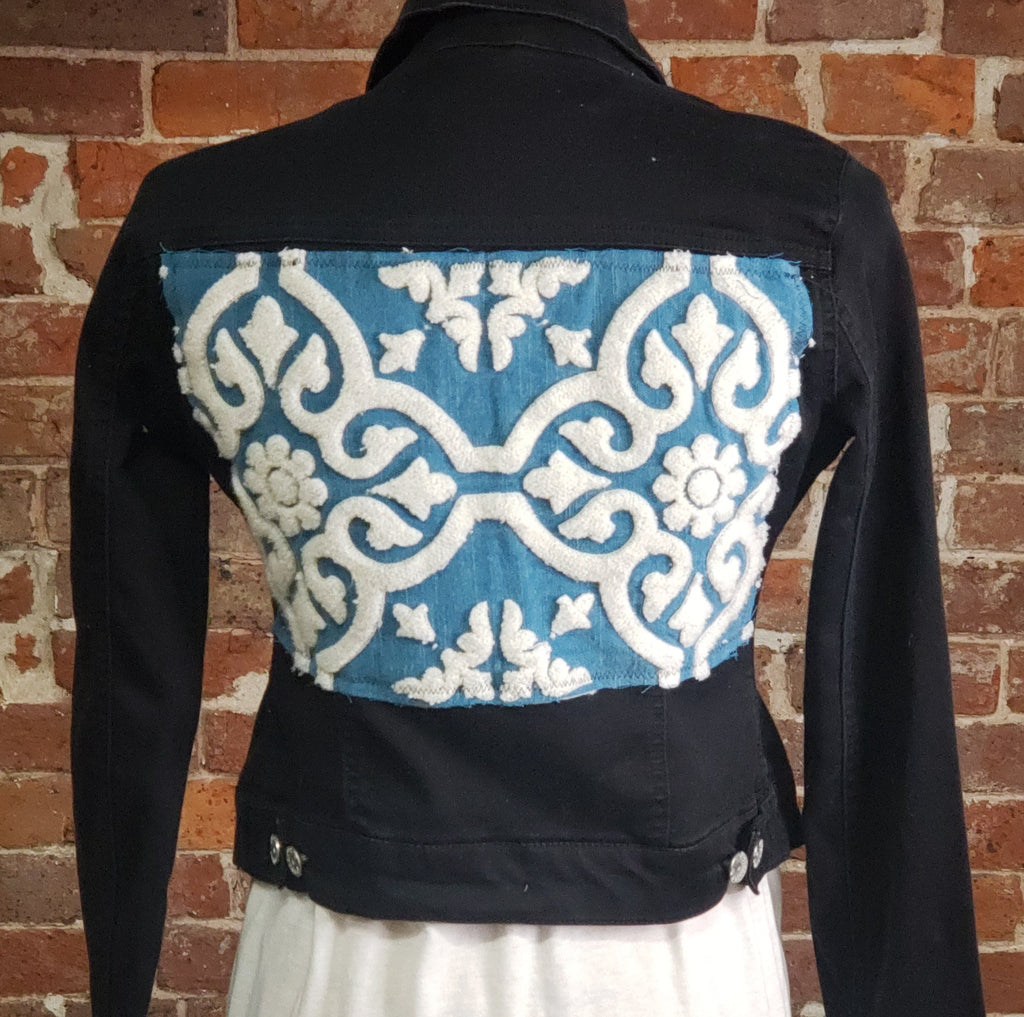 "Blue Moon" Upcycled Denim Jacket, black denim jacket - Almost Famous Brand, Size Medium. Cotton/poly with spandex.   An applique was created with awesome turquoise and white embroidery crafted on the back of this jacket.